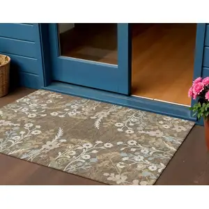 Photo of Chocolate Ivory And Blue Floral Washable Indoor Outdoor Area Rug
