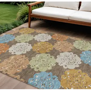 Photo of Chocolate Ivory And Copper Quatrefoil Washable Indoor Outdoor Area Rug