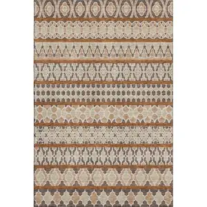 Photo of Chocolate Ivory And Taupe Ikat Washable Area Rug With UV Protection
