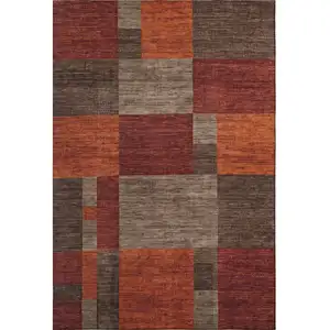 Photo of Chocolate Orange And Rust Geometric Washable Area Rug With UV Protection