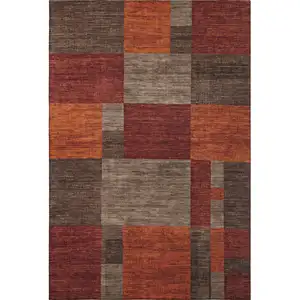 Photo of Chocolate Orange And Rust Geometric Washable Area Rug With UV Protection