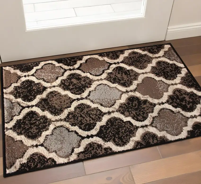 Brown Black And Ivory Quatrefoil Distressed Area Rug Photo 1