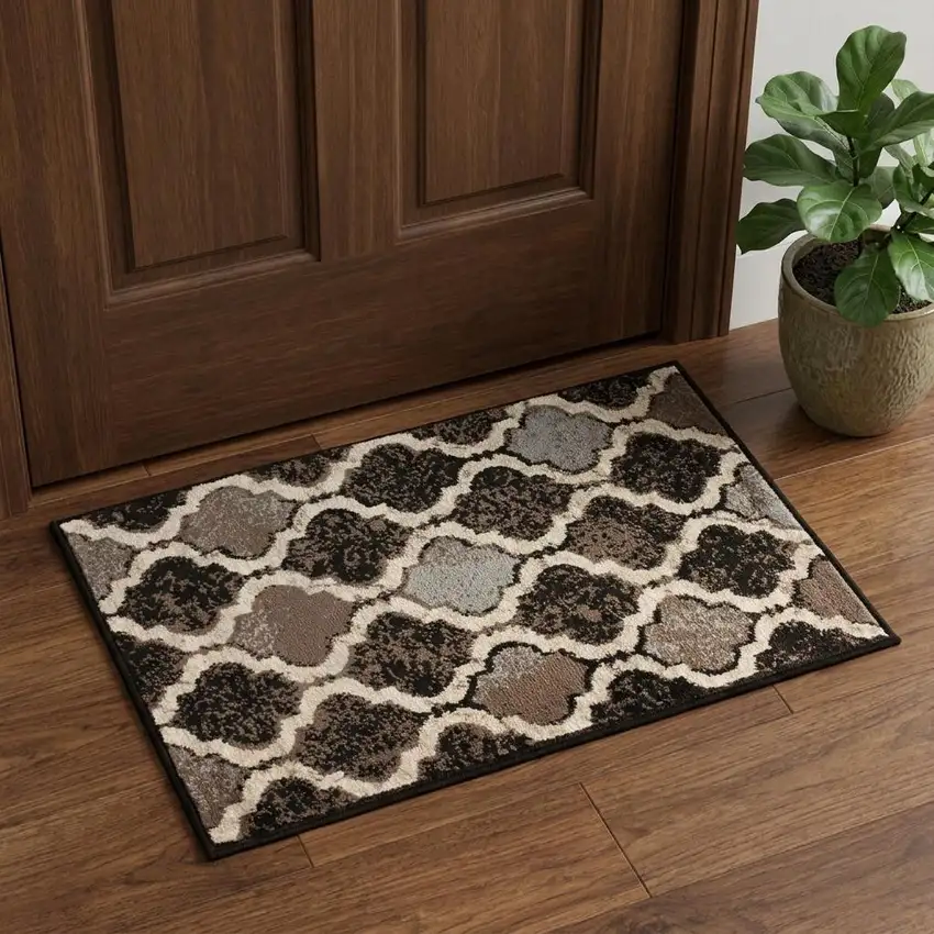 Brown Black And Ivory Quatrefoil Distressed Area Rug Photo 1