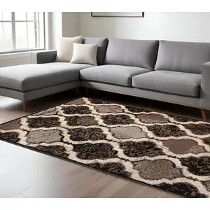 Photo of Chocolate Quatrefoil Power Loom Distressed Stain Resistant Area Rug