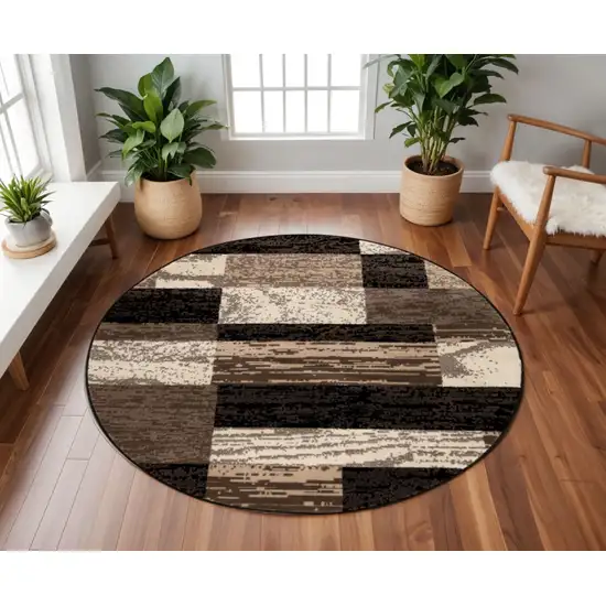 8' Black Brown And Beige Patchwork Round Rug Photo 1