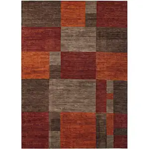 Photo of Chocolate Taupe And Orange Geometric Washable Indoor Outdoor Area Rug