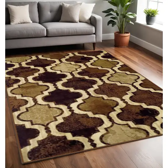 Coffee Beige And Black Quatrefoil Distressed Area Rug Photo 1
