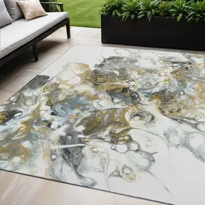 Photo of Cool Gray And Gold Abstract Washable Indoor Outdoor Area Rug