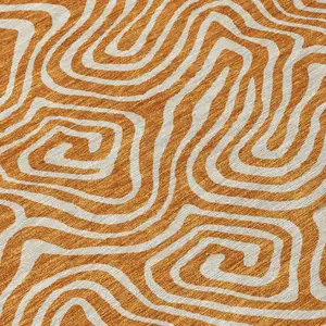 Photo of Copper And Beige Abstract Washable Indoor Outdoor Area Rug