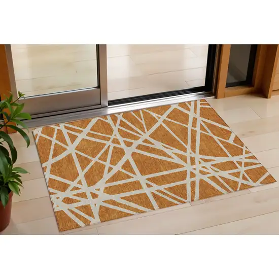 Copper And Beige Geometric Washable Indoor Outdoor Area Rug Photo 1
