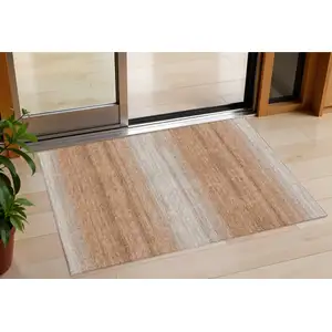 Photo of Copper And Beige Striped Washable Indoor Outdoor Area Rug