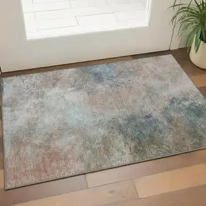 Photo of Copper And Blue Abstract Washable Area Rug With UV Protection