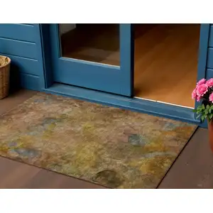 Photo of Copper And Gold Abstract Washable Indoor Outdoor Area Rug