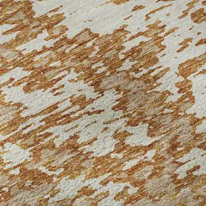 Photo of Copper And Ivory Abstract Washable Area Rug With UV Protection