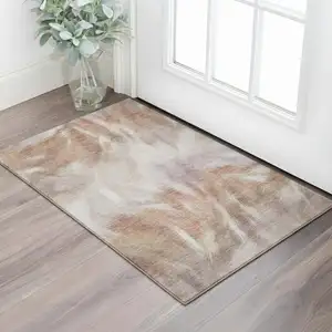 Photo of Copper And Ivory Abstract Washable Area Rug With UV Protection