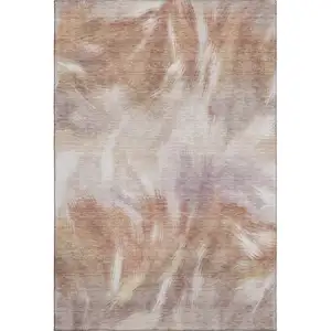 Photo of Copper And Ivory Abstract Washable Area Rug With UV Protection