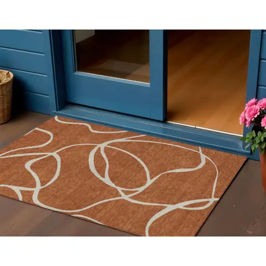 Copper And Ivory Abstract Washable Indoor Outdoor Area Rug Photo 1