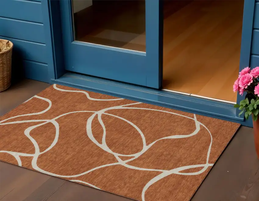 Copper And Ivory Abstract Washable Indoor Outdoor Area Rug Photo 1