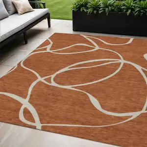 Photo of Copper And Ivory Abstract Washable Indoor Outdoor Area Rug