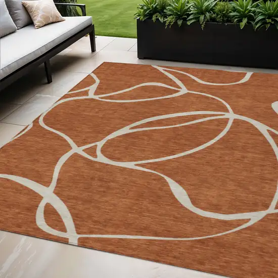 Copper And Ivory Abstract Washable Indoor Outdoor Area Rug Photo 1