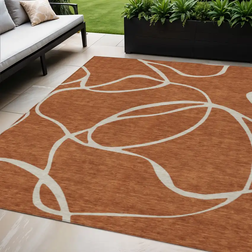 Copper And Ivory Abstract Washable Indoor Outdoor Area Rug Photo 1