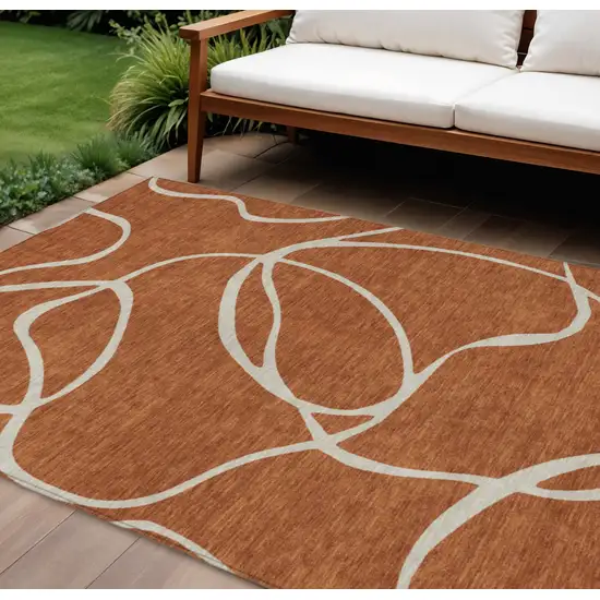 Copper And Ivory Abstract Washable Indoor Outdoor Area Rug Photo 1