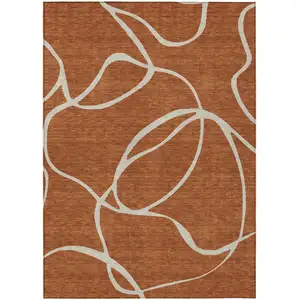 Photo of Copper And Ivory Abstract Washable Indoor Outdoor Area Rug