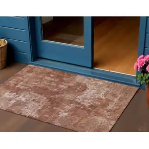 Photo of Copper And Ivory Abstract Washable Indoor Outdoor Area Rug