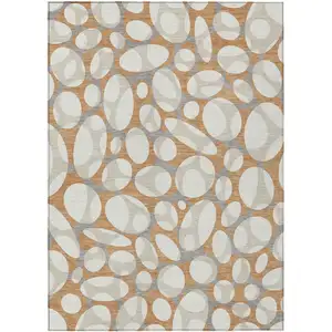 Photo of Copper And Ivory Abstract Washable Indoor Outdoor Area Rug