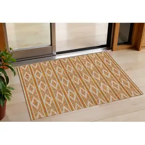 Photo of Copper And Ivory Geometric Washable Indoor Outdoor Area Rug