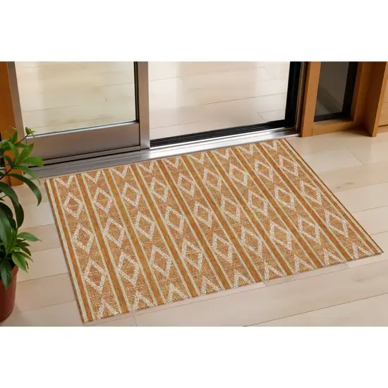 Copper And Ivory Geometric Washable Indoor Outdoor Area Rug Photo 1