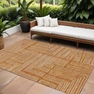 Photo of Copper And Ivory Geometric Washable Indoor Outdoor Area Rug