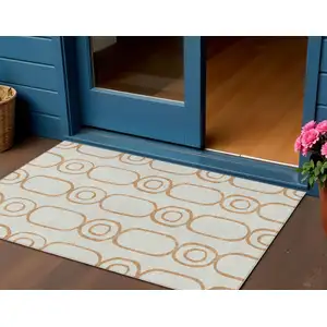 Photo of Copper And Ivory Geometric Washable Indoor Outdoor Area Rug