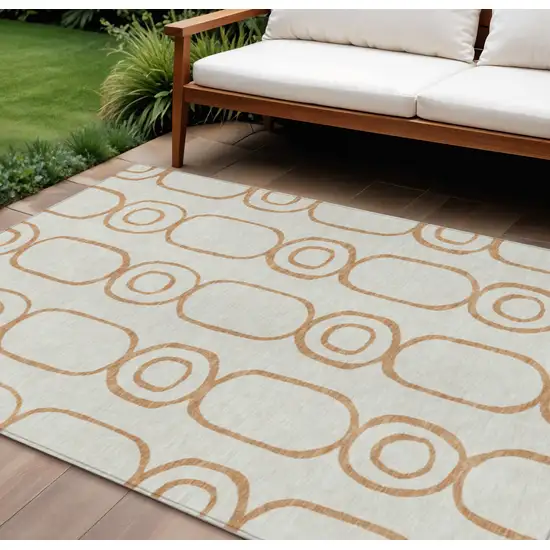 Copper And Ivory Geometric Washable Indoor Outdoor Area Rug Photo 1