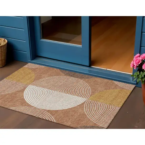 Copper And Ivory Geometric Washable Indoor Outdoor Area Rug Photo 1