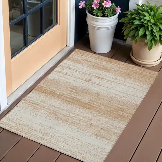Copper And Ivory Striped Washable Indoor Outdoor Area Rug Photo 1
