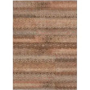 Photo of Copper And Peach Striped Washable Indoor Outdoor Area Rug