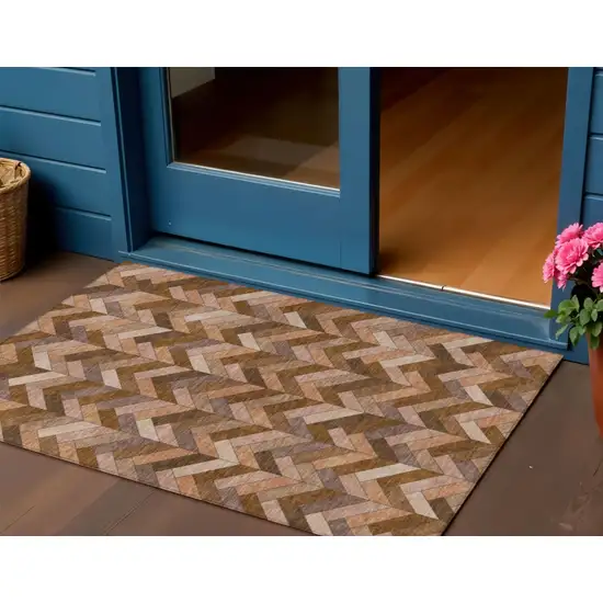 Copper And Rust Geometric Washable Indoor Outdoor Area Rug Photo 1