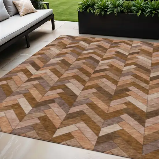 Copper And Rust Geometric Washable Indoor Outdoor Area Rug Photo 1