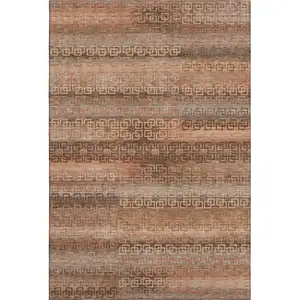Photo of Copper And Rust Striped Washable Area Rug With UV Protection
