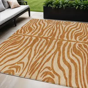 Photo of Copper And Tan Animal Print Washable Indoor Outdoor Area Rug