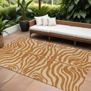 Photo of Copper And Tan Animal Print Washable Indoor Outdoor Area Rug