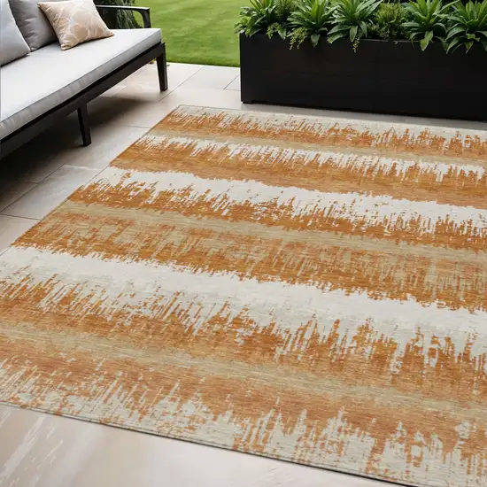 Copper Beige And Ivory Striped Washable Indoor Outdoor Area Rug Photo 1