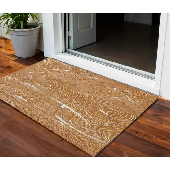 Copper Brown And Ivory Abstract Washable Indoor Outdoor Area Rug Photo 1
