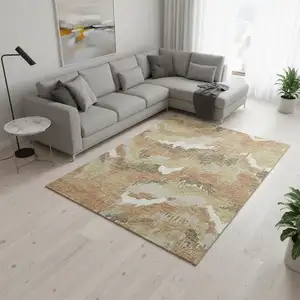 Photo of Copper Gold And Ivory Abstract Washable Area Rug With UV Protection