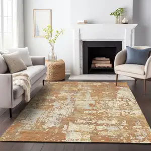 Photo of Copper Gold And Ivory Abstract Washable Indoor Outdoor Area Rug