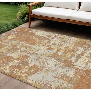 Photo of Copper Gold And Ivory Abstract Washable Indoor Outdoor Area Rug