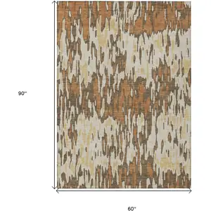 Photo of Copper Gold And Ivory Striped Washable Indoor Outdoor Area Rug