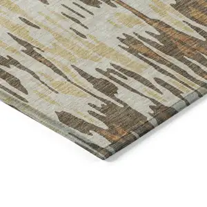 Photo of Copper Gold And Ivory Striped Washable Indoor Outdoor Area Rug