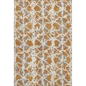 Photo of Copper Gray And Ivory Abstract Washable Area Rug With UV Protection